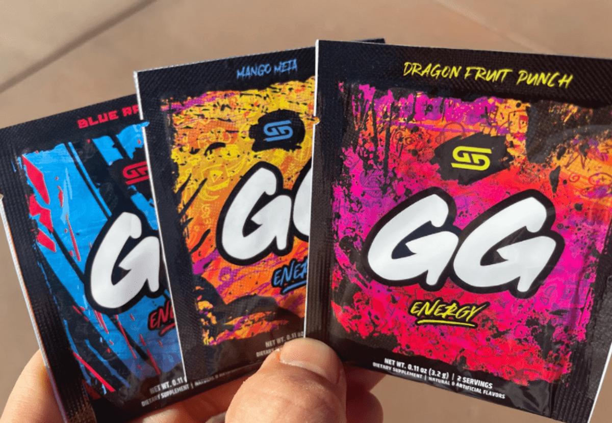 Three sachets of GG Gamer Supps in hand.