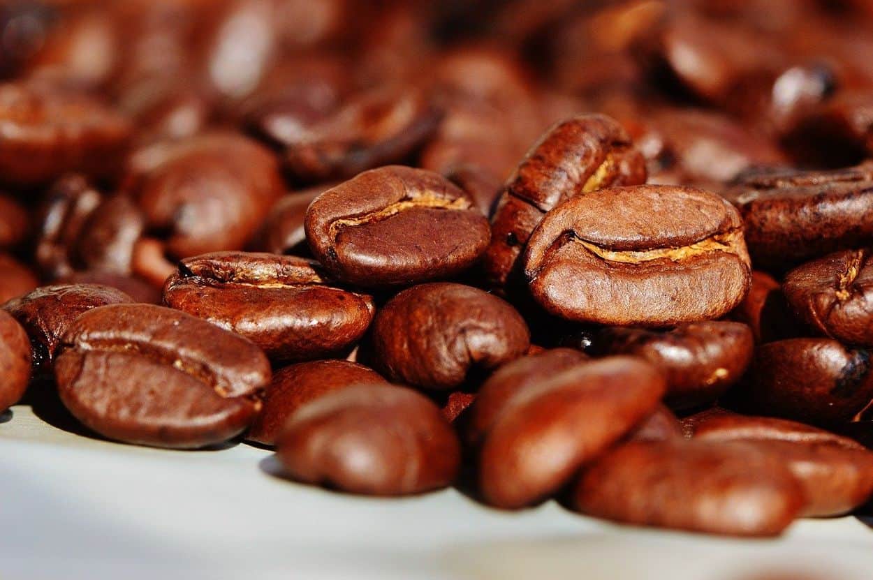 A handful of roasted coffee beans.