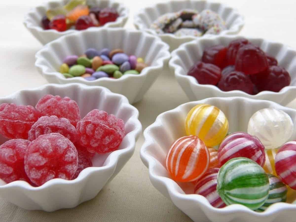 Bubblegums and sweet candies in different bowls.