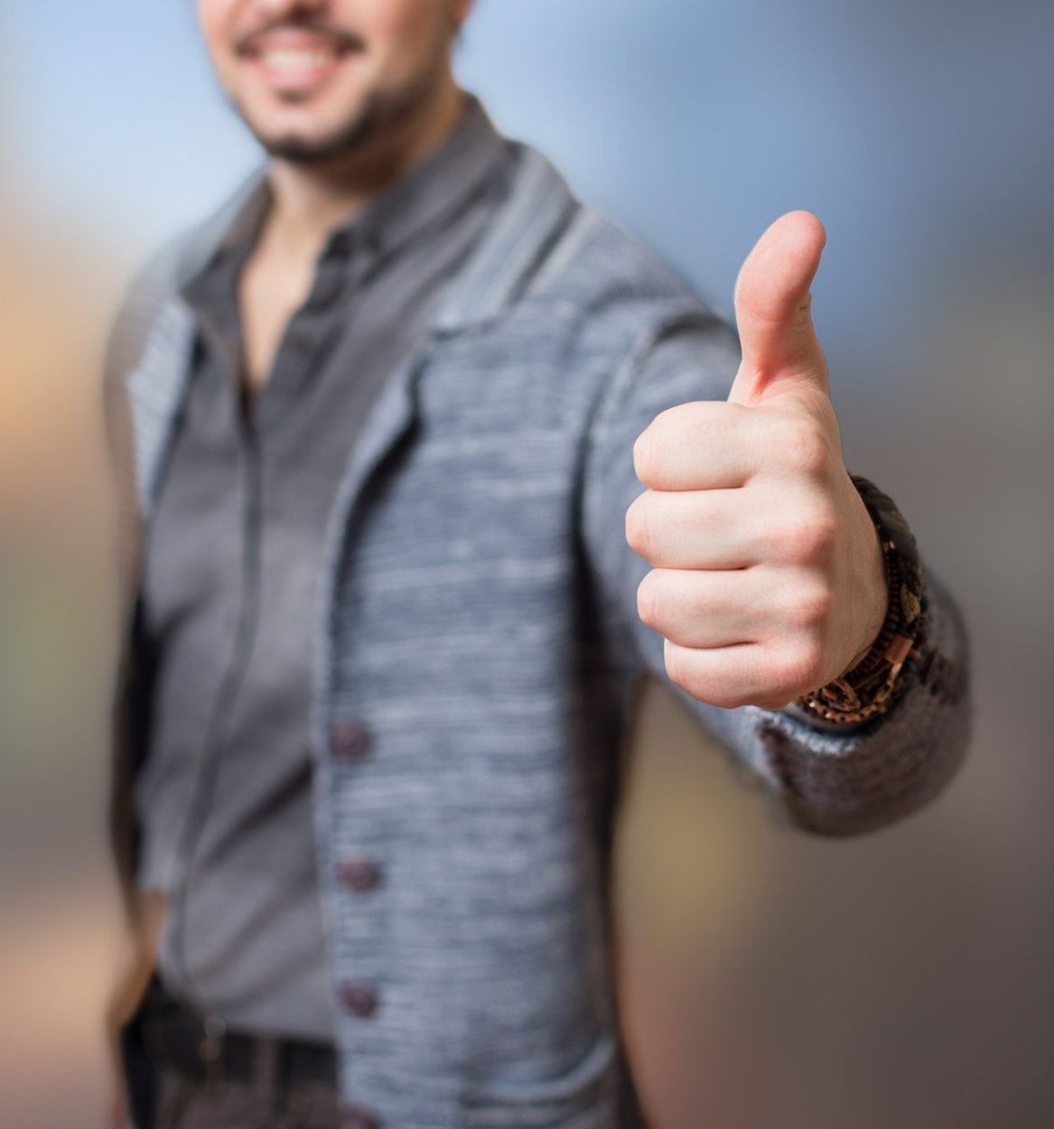 A man giving thumbs up.