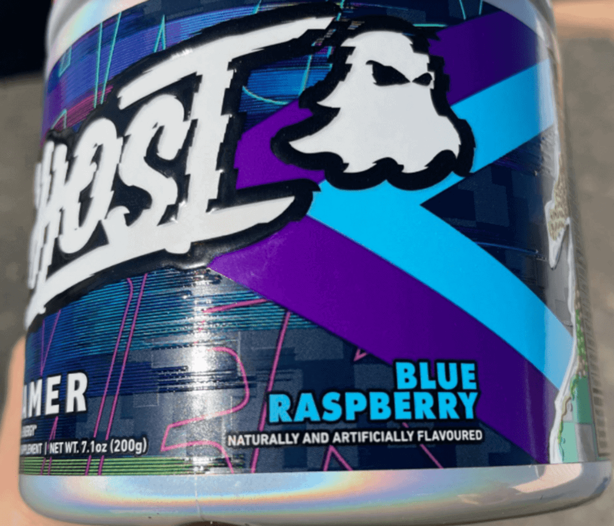A tub that includes the blue raspberry flavor of Ghost Gamer.