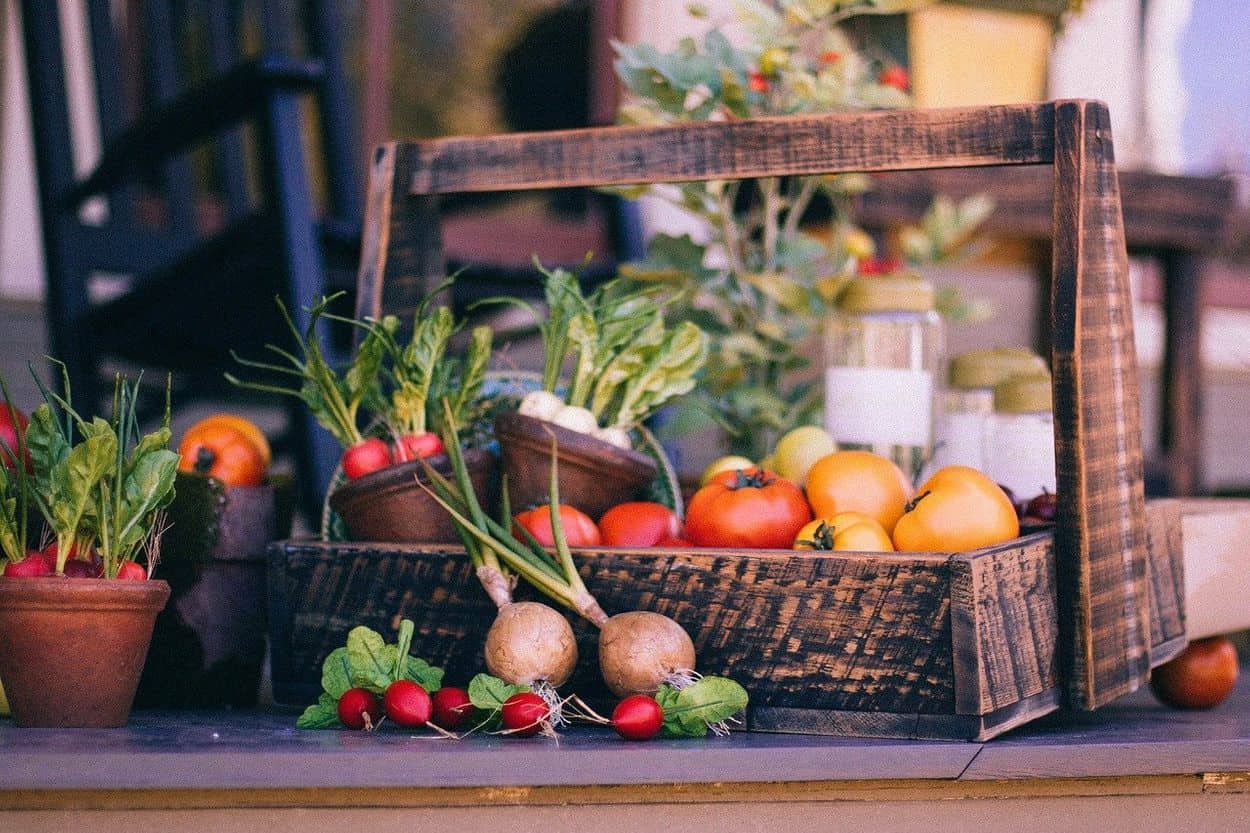 A basket is full of vegetables.