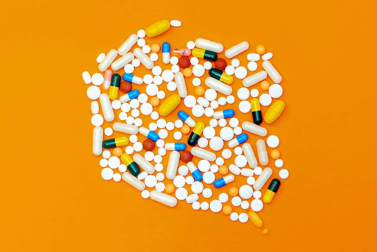 Multivitamin pills on a floor