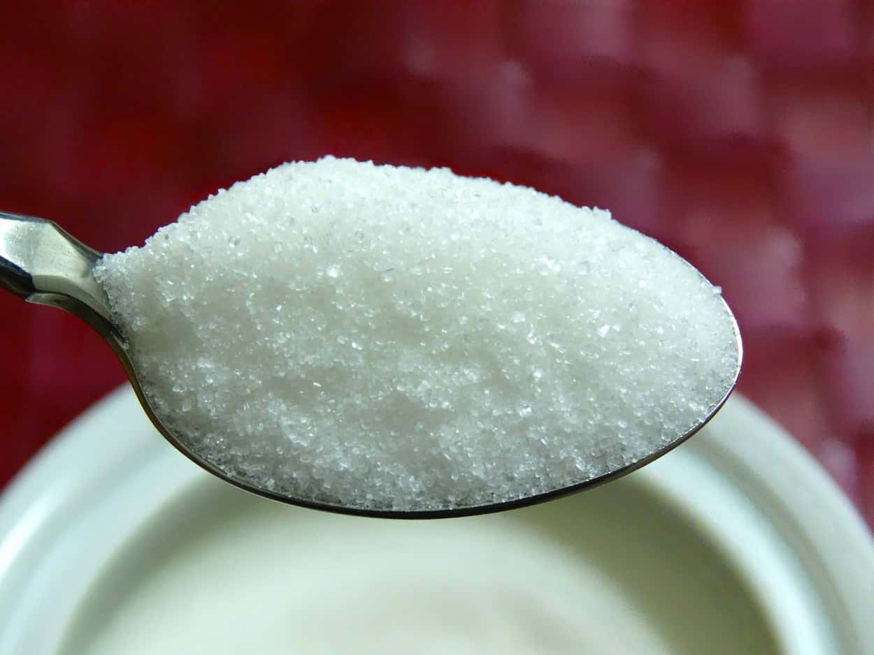 Table sugar in a spoon